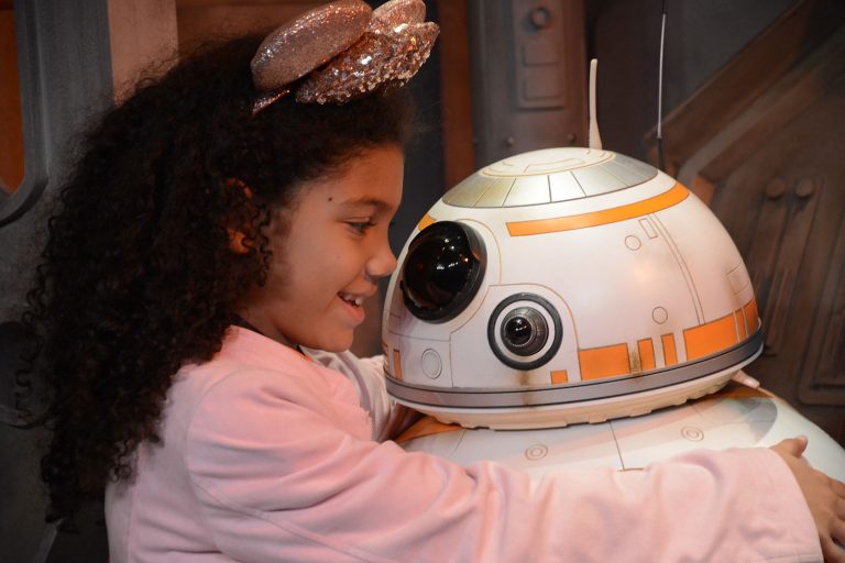 Little biracial girl meets BB-8 on the Star Wars Guided Tour at Disney's Hollywood Studios